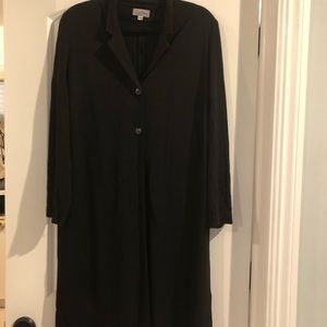 Two piece black women’s suit.